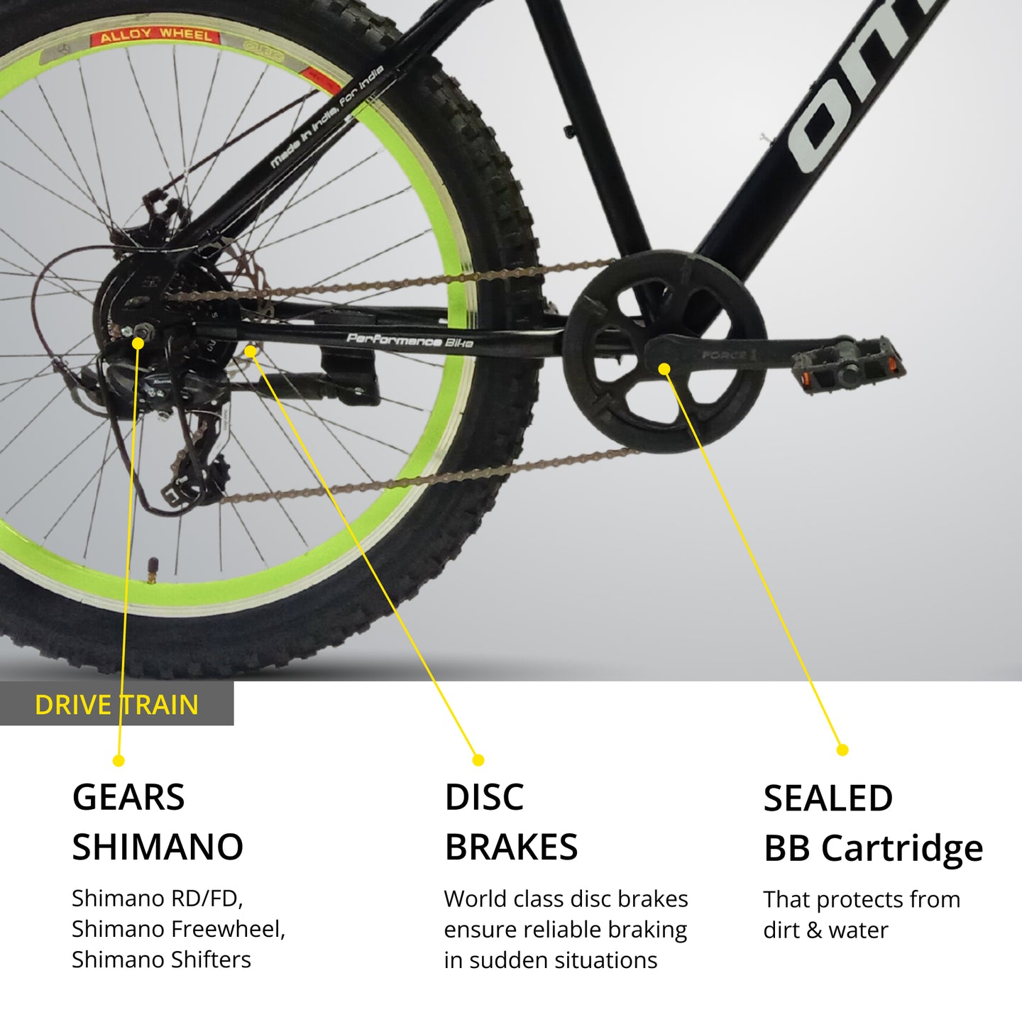 omobikes vagator geared semi fat MTB bike with shimano gear platform pedal drivetrain wheel side view