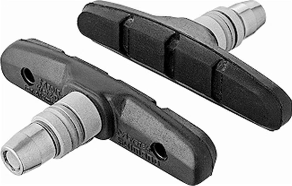 Two bicycle brake pads on a white background