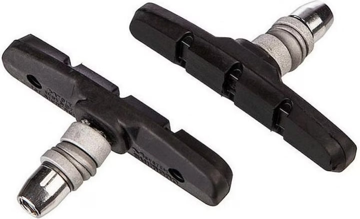 Two bicycle brake shoes on a white background