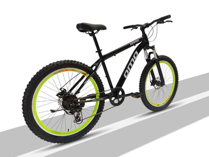 omobikes vagator shimano geared semi fat MTB bike with suspension disc brakes green color side view